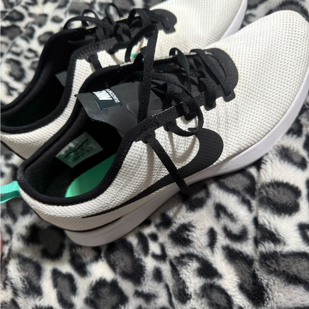 Nike men’s White and Black Sneakers